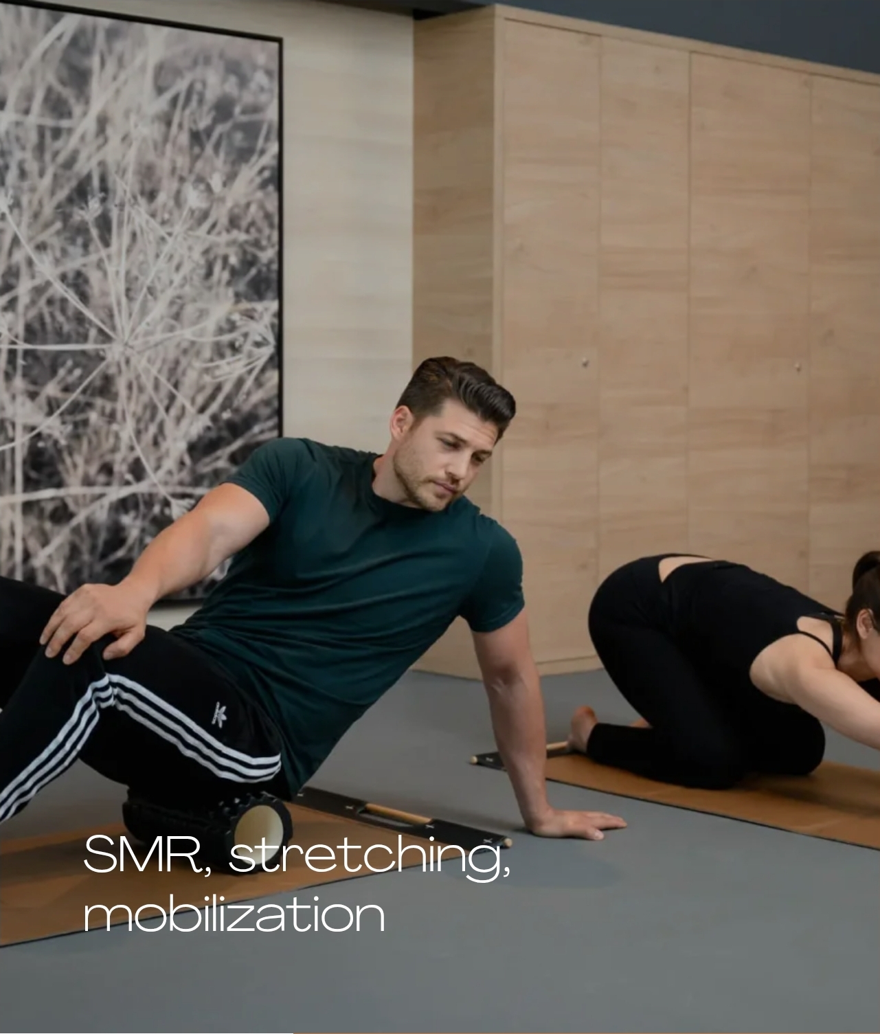 Guests practising SMR rolling and stretching on mats at Melea