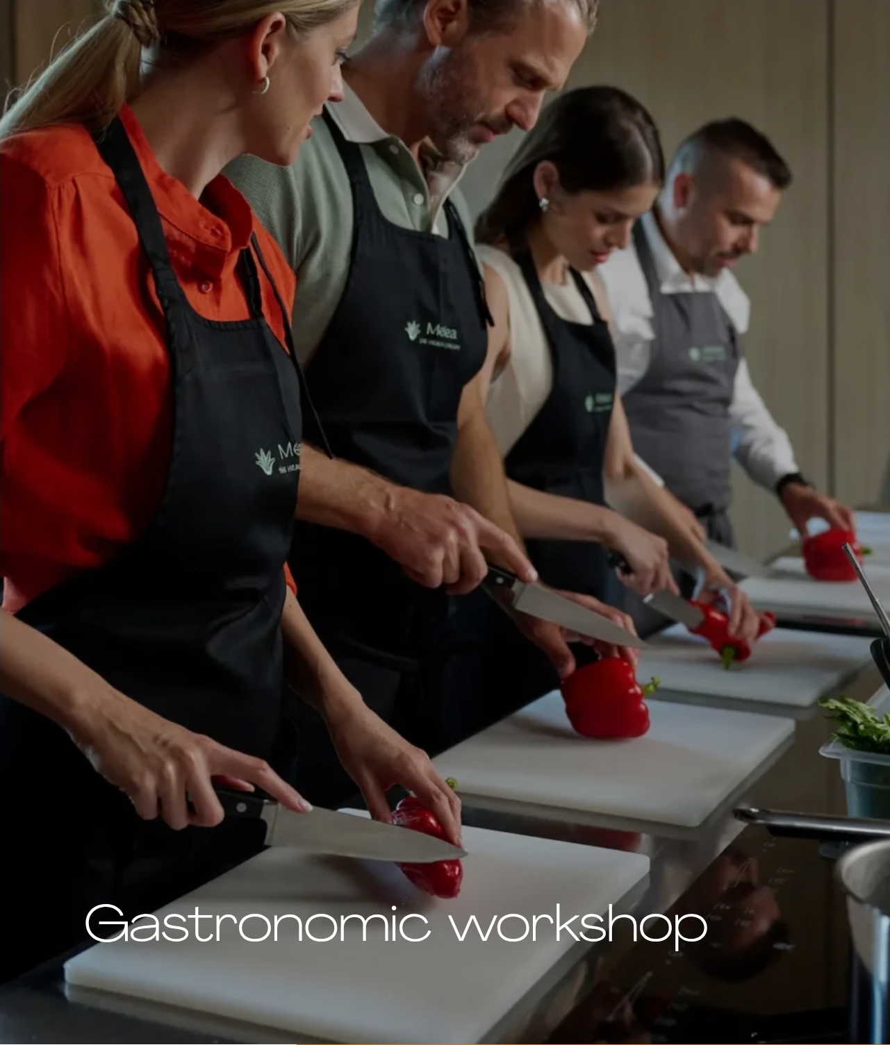 Guests preparing food in a Melea cooking workshop
