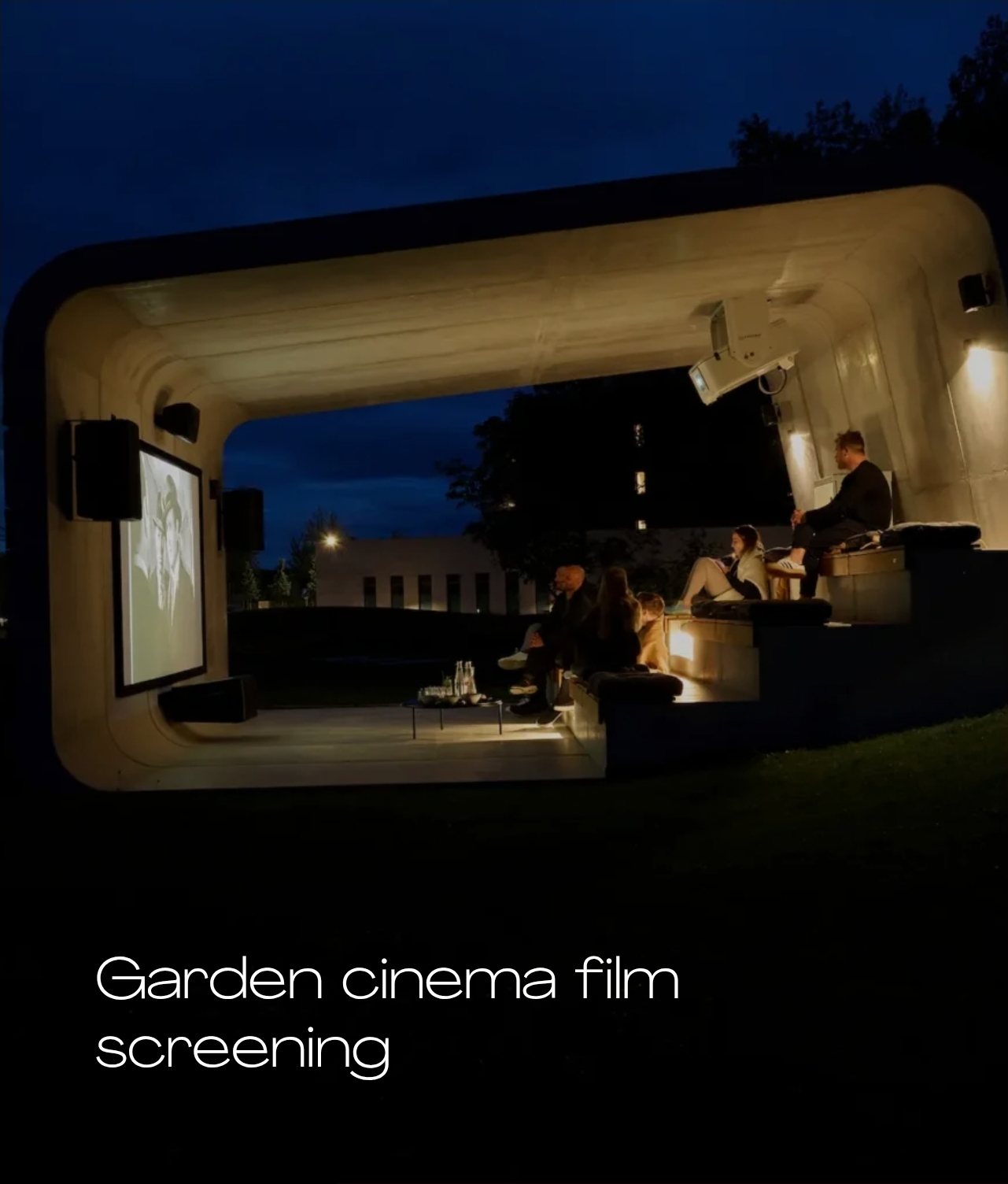 Evening garden cinema screening at Melea